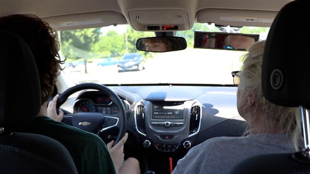  Student and Instructor Driving Down Cedar Crest Boulevard
